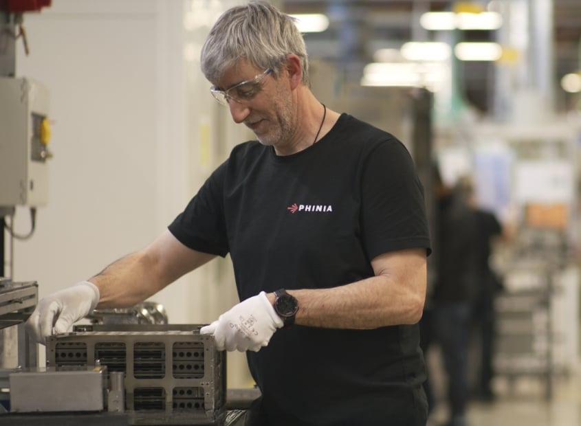 Colleague at Blois plant loading trays into machines
