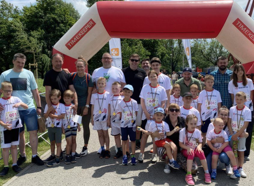 Parents and children ready to take part in a colorful sock fun run