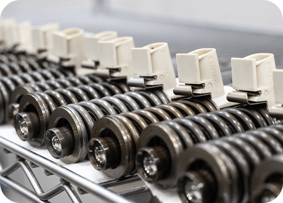 Remanufactured automotive components arranged on a production line in a manufacturing facility