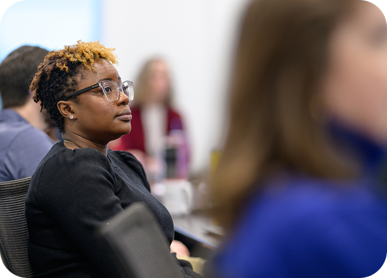Employee listening attentively during a training session.
