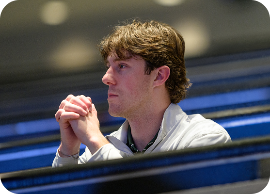 Employee in a conference room listening during a training session.