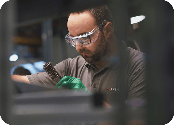 Engineer inspecting production equipment at an industrial facility.