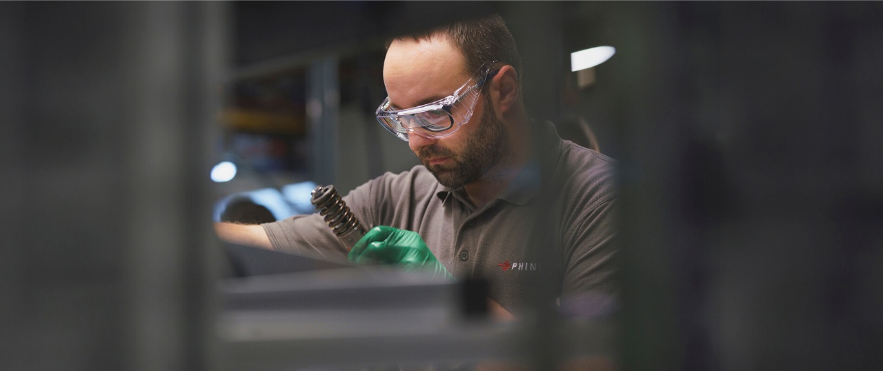 Engineer inspecting production equipment at an industrial facility.