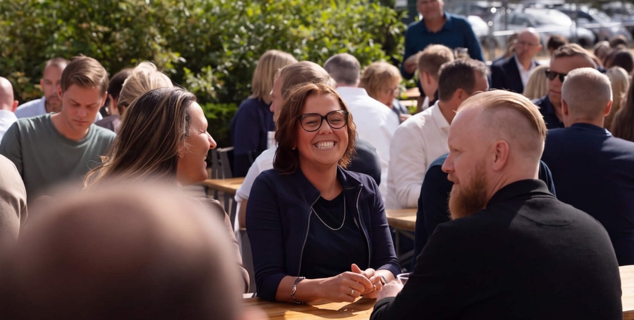 Employees talking and networking at a company social event.